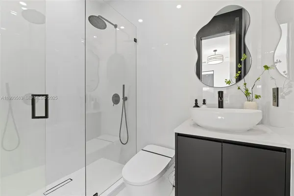 an aerial view of a house with a ocean view