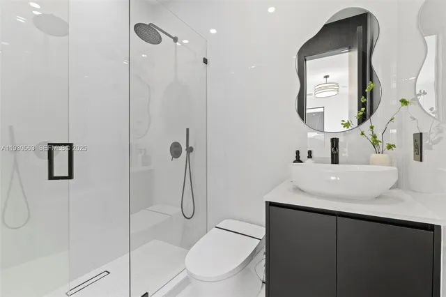 an aerial view of a house with a ocean view