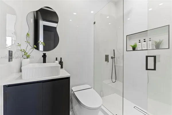 an aerial view of a residential houses with outdoor space