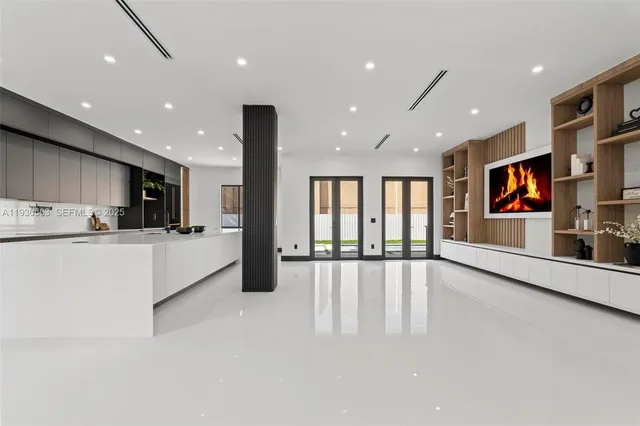 a view of a kitchen with stainless steel appliances granite countertop a stove and a refrigerator