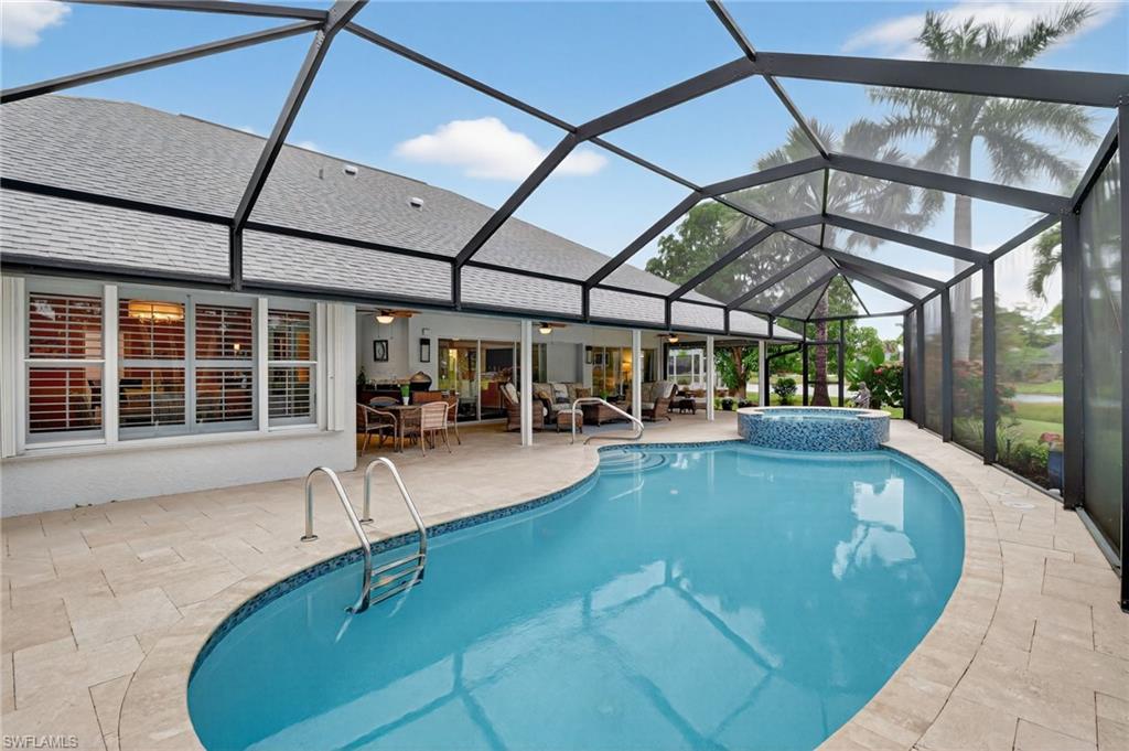 2248 Prince Lane Naples, FL 34112 - Photo 19 of 47 a view of a swimming pool with a patio