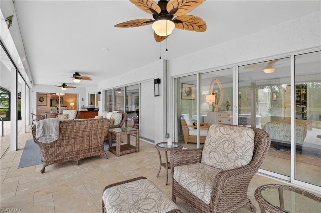 2248 Prince Lane Naples, FL 34112 - Photo 20 of 47 a living room with furniture and a chandelier
