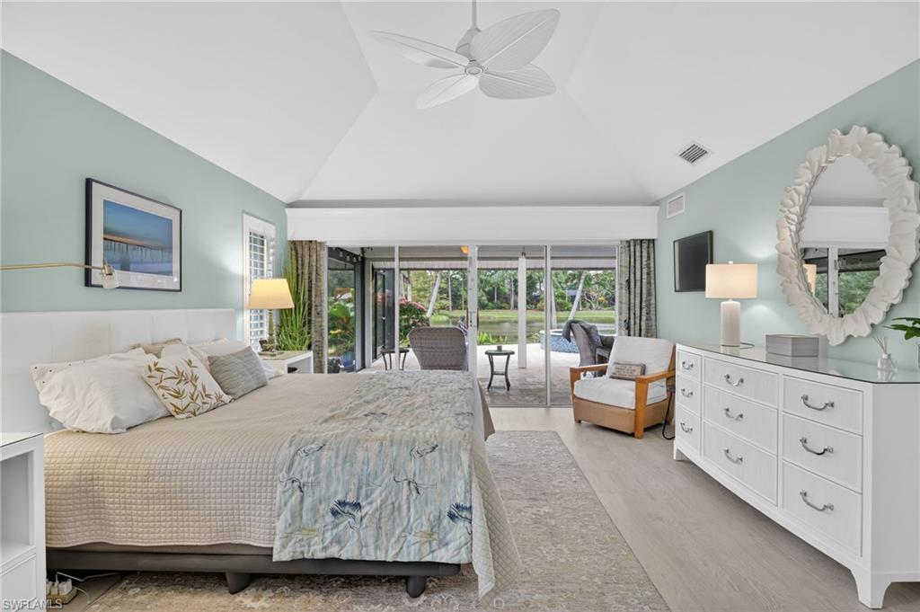 2248 Prince Lane Naples, FL 34112 - Photo 22 of 47 a bedroom with a bed and a large window