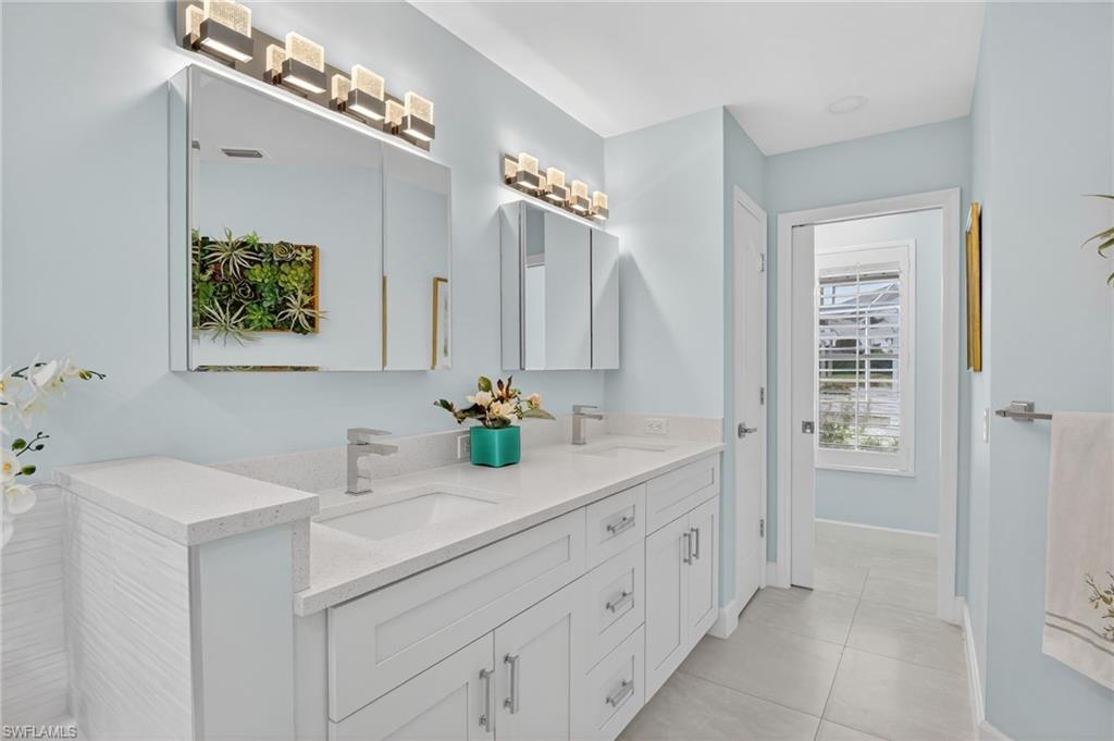 2248 Prince Lane Naples, FL 34112 - Photo 26 of 47 a bathroom with a sink double vanity and a mirror