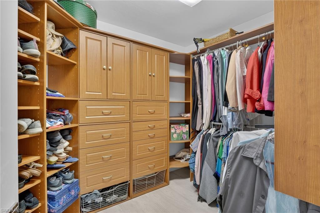 2248 Prince Lane Naples, FL 34112 - Photo 27 of 47 a view of walk in closet with clothes and shoes