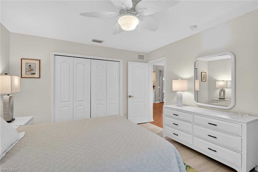 2248 Prince Lane Naples, FL 34112 - Photo 29 of 47 a bedroom with a bed and a dresser
