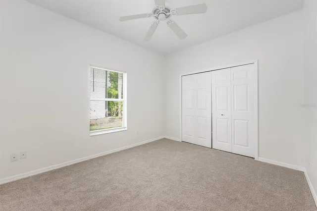 a bathroom with a sink toilet and a mirror