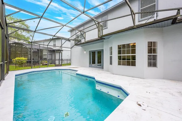 a swimming pool with a outdoor seating