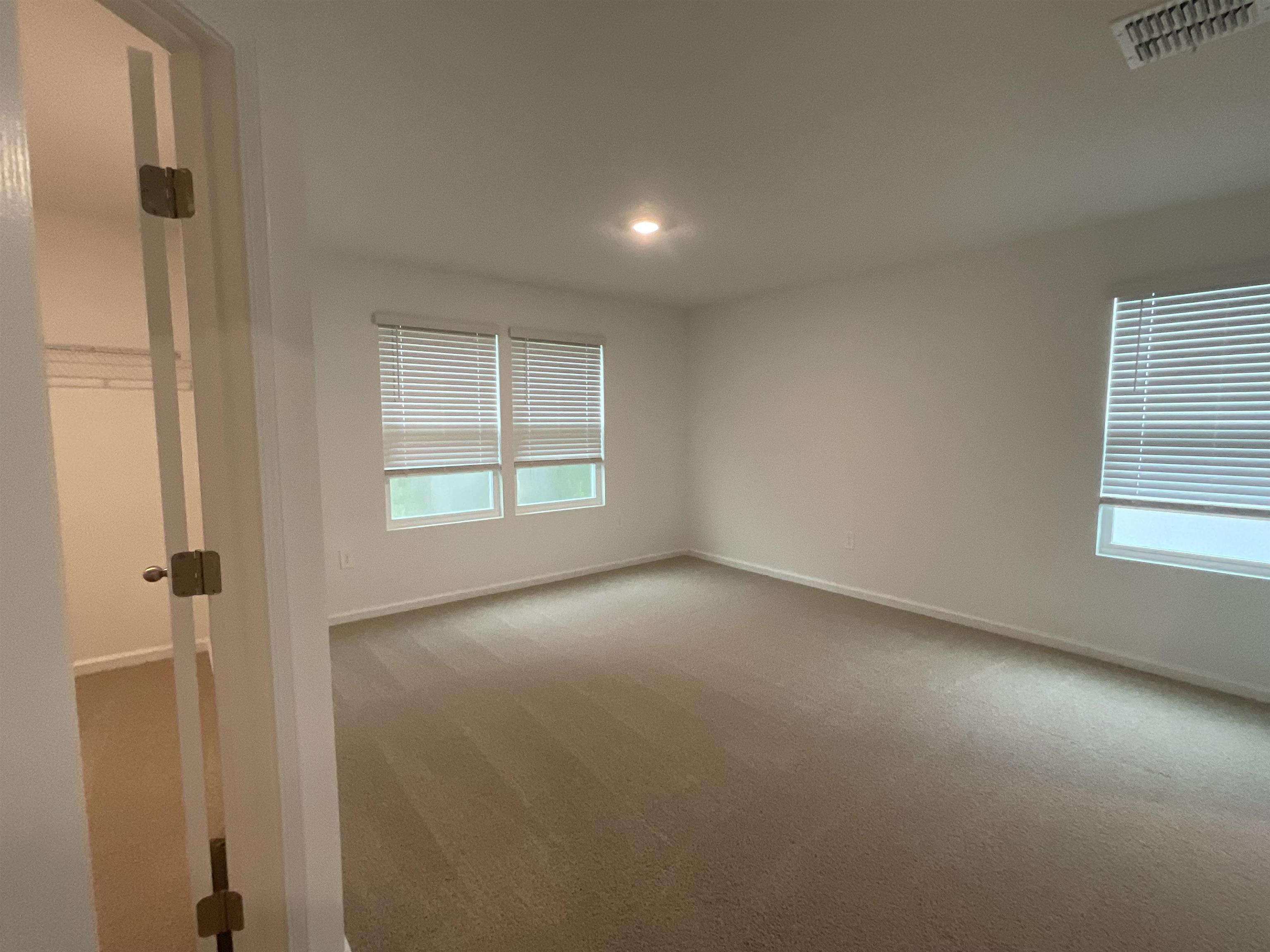 245 Seaport Breeze Road St. Augustine, FL 32095 - Photo 17 of 23 an empty room with windows and closet