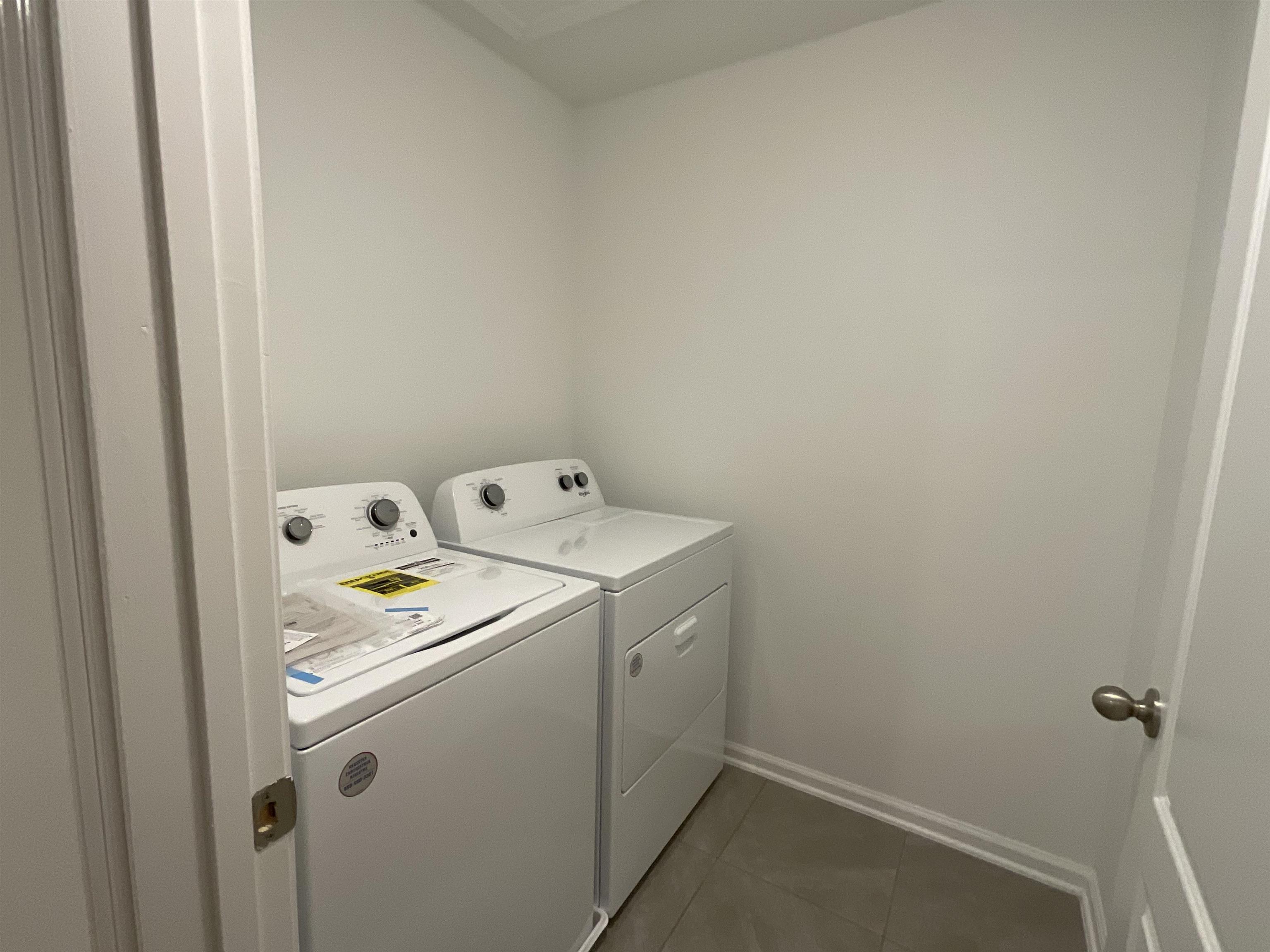 245 Seaport Breeze Road St. Augustine, FL 32095 - Photo 18 of 23 a utility room with dryer and washer