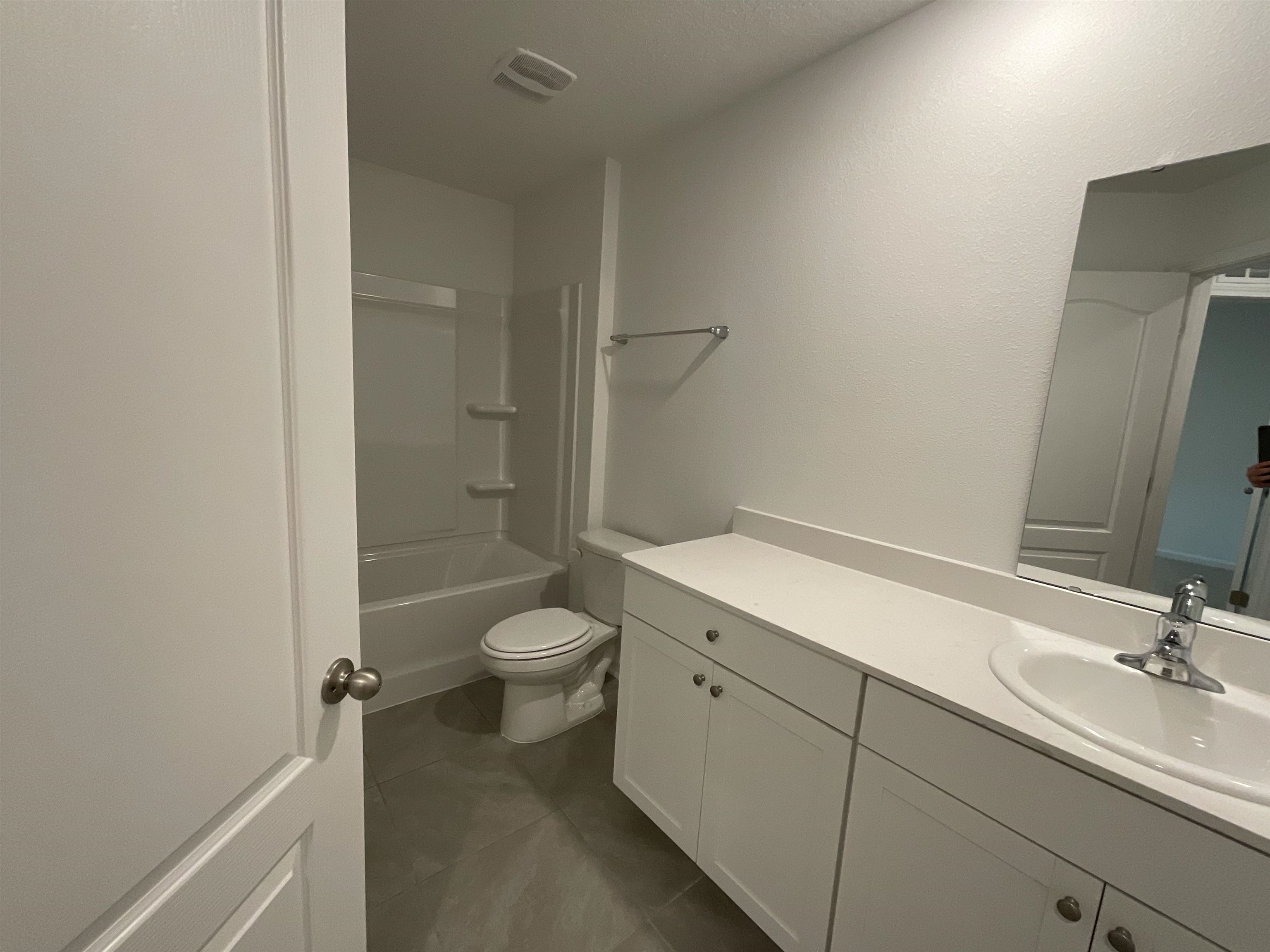 245 Seaport Breeze Road St. Augustine, FL 32095 - Photo 3 of 23 a bathroom with a sink a toilet and shower
