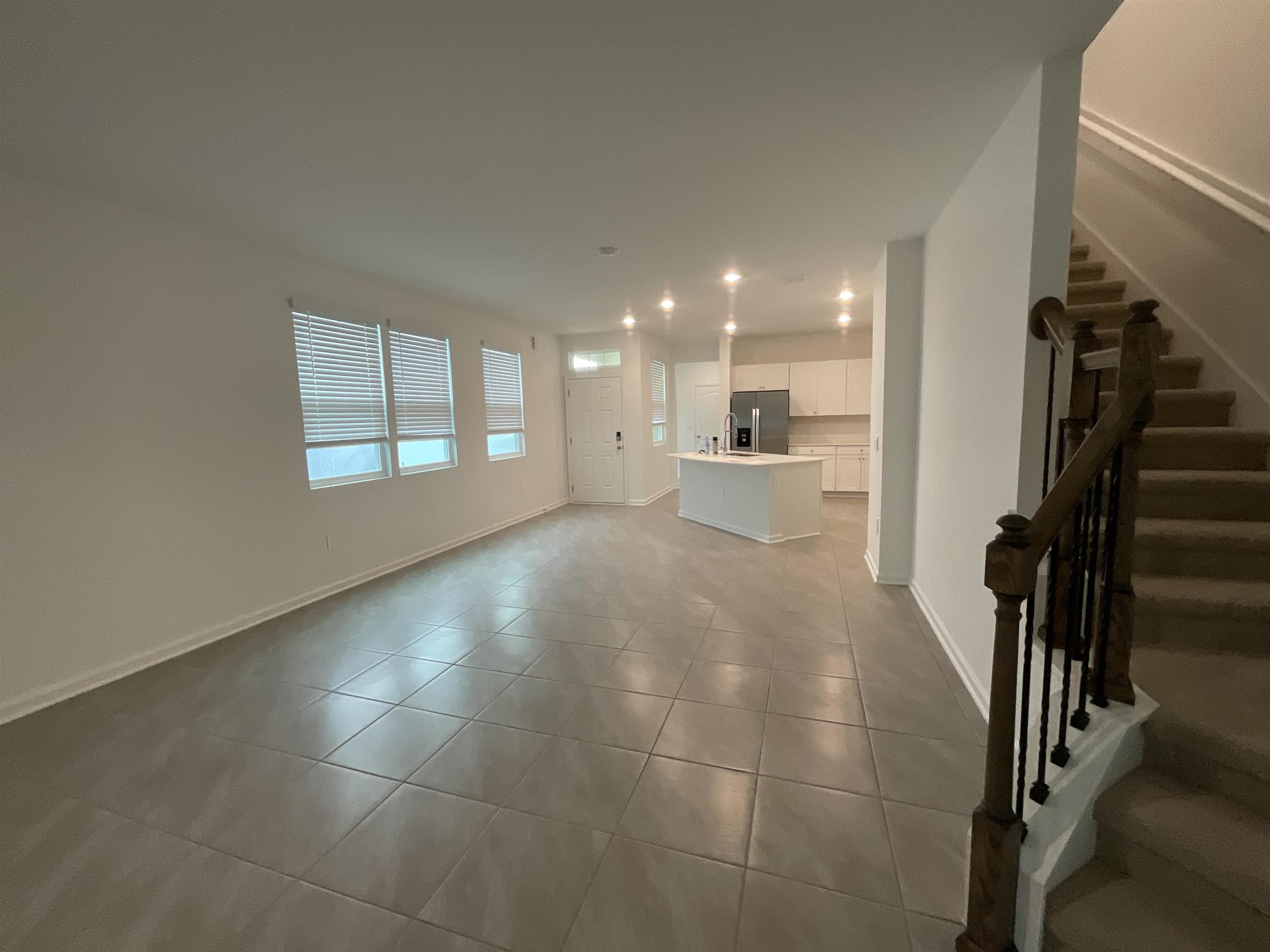 245 Seaport Breeze Road St. Augustine, FL 32095 - Photo 4 of 23 a view of entryway and hall with wooden floor