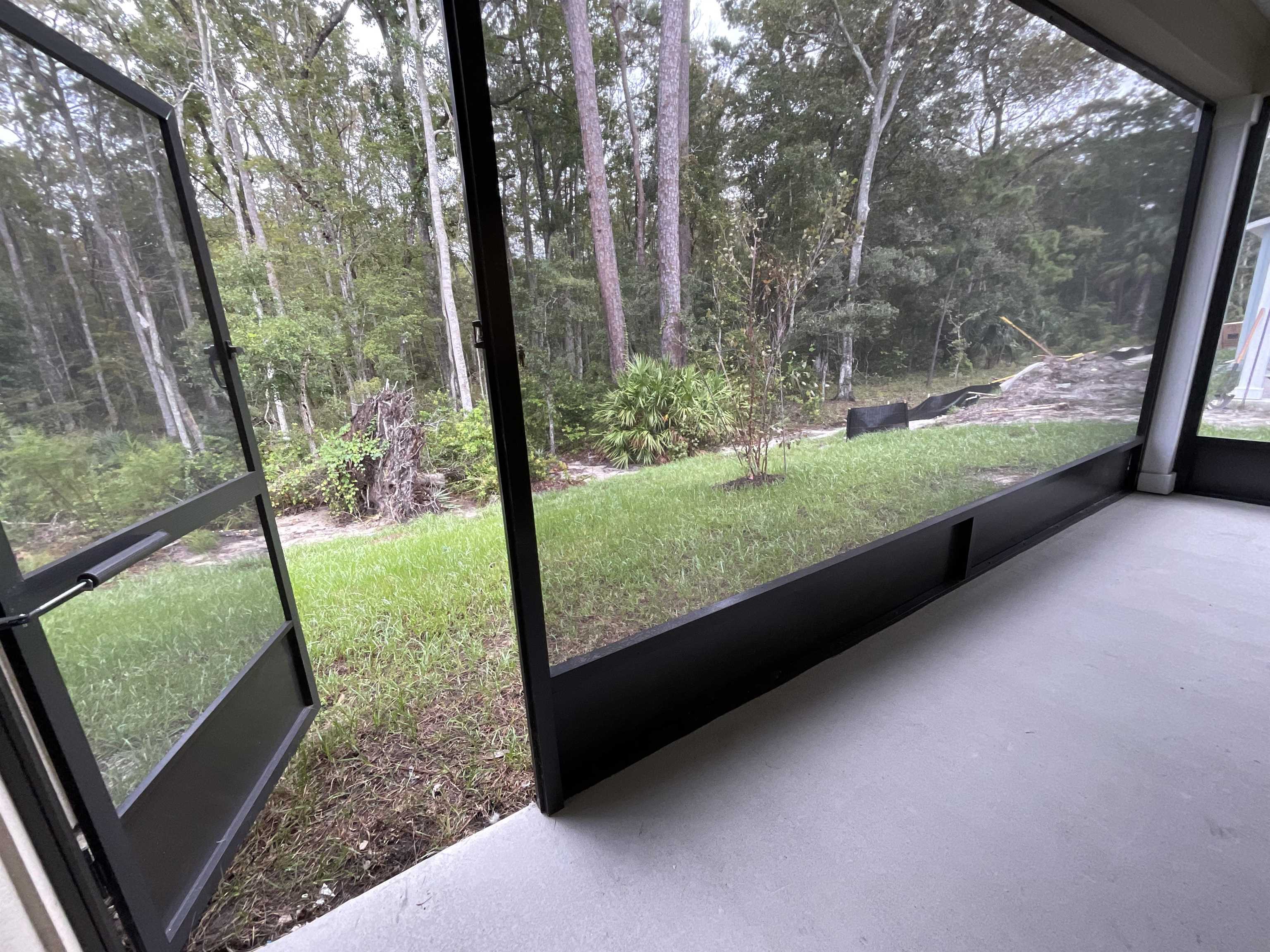 245 Seaport Breeze Road St. Augustine, FL 32095 - Photo 5 of 23 a view of a yard with large trees