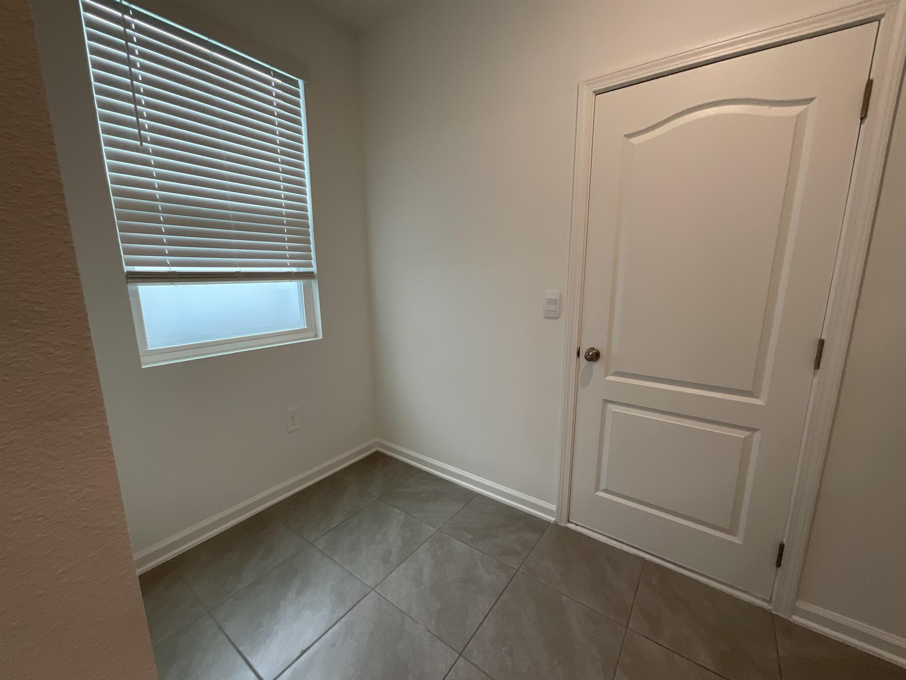 245 Seaport Breeze Road St. Augustine, FL 32095 - Photo 9 of 23 a view of an empty room with a window