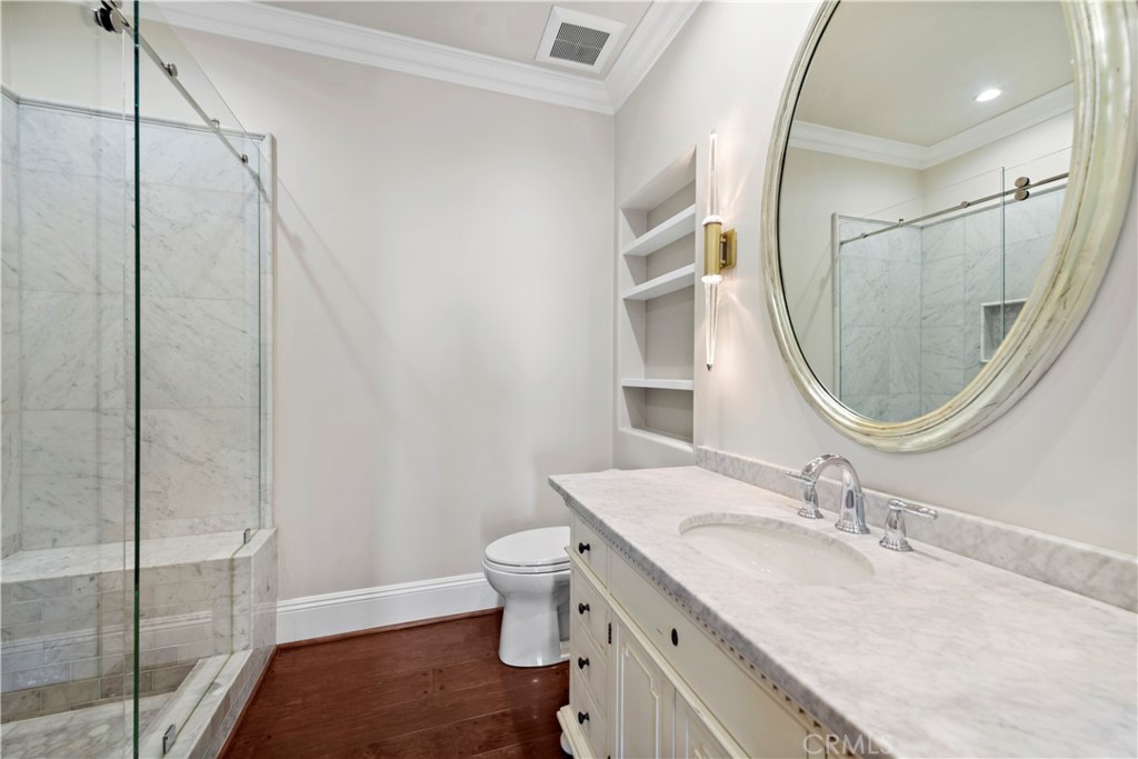 25 Splendore Drive Newport Coast, CA 92657 - Photo 12 of 16 a bathroom with a sink a toilet and a mirror