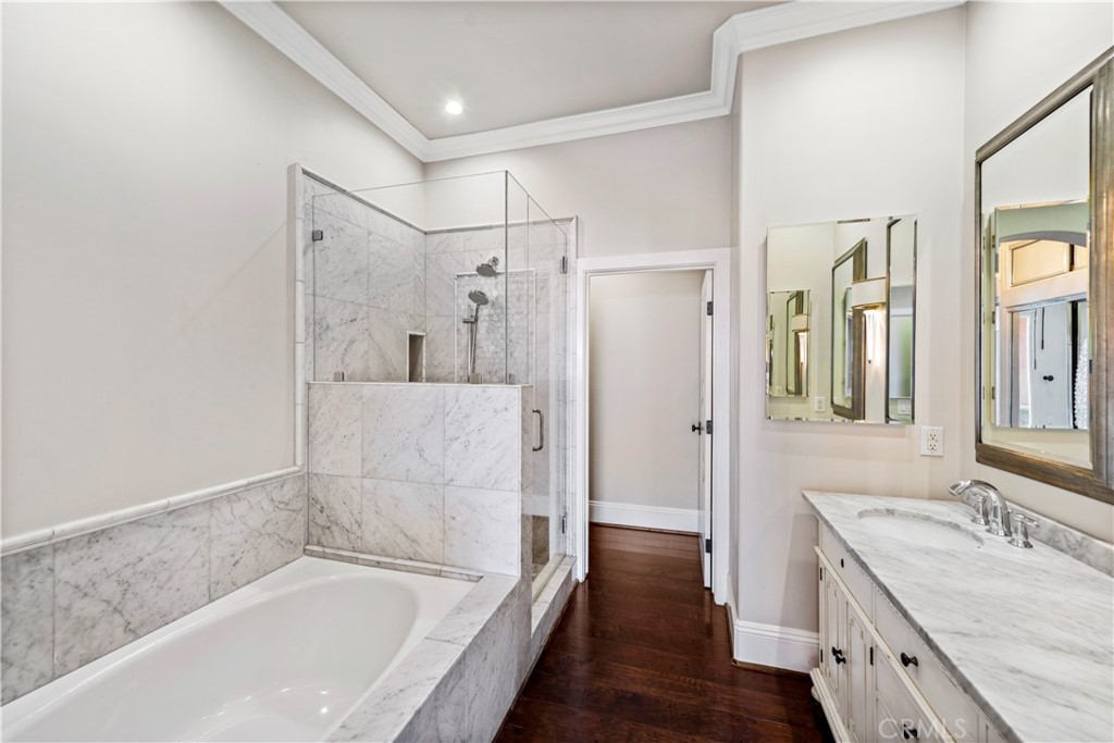 25 Splendore Drive Newport Coast, CA 92657 - Photo 9 of 16 a bathroom with a granite countertop bathtub shower sink and mirror