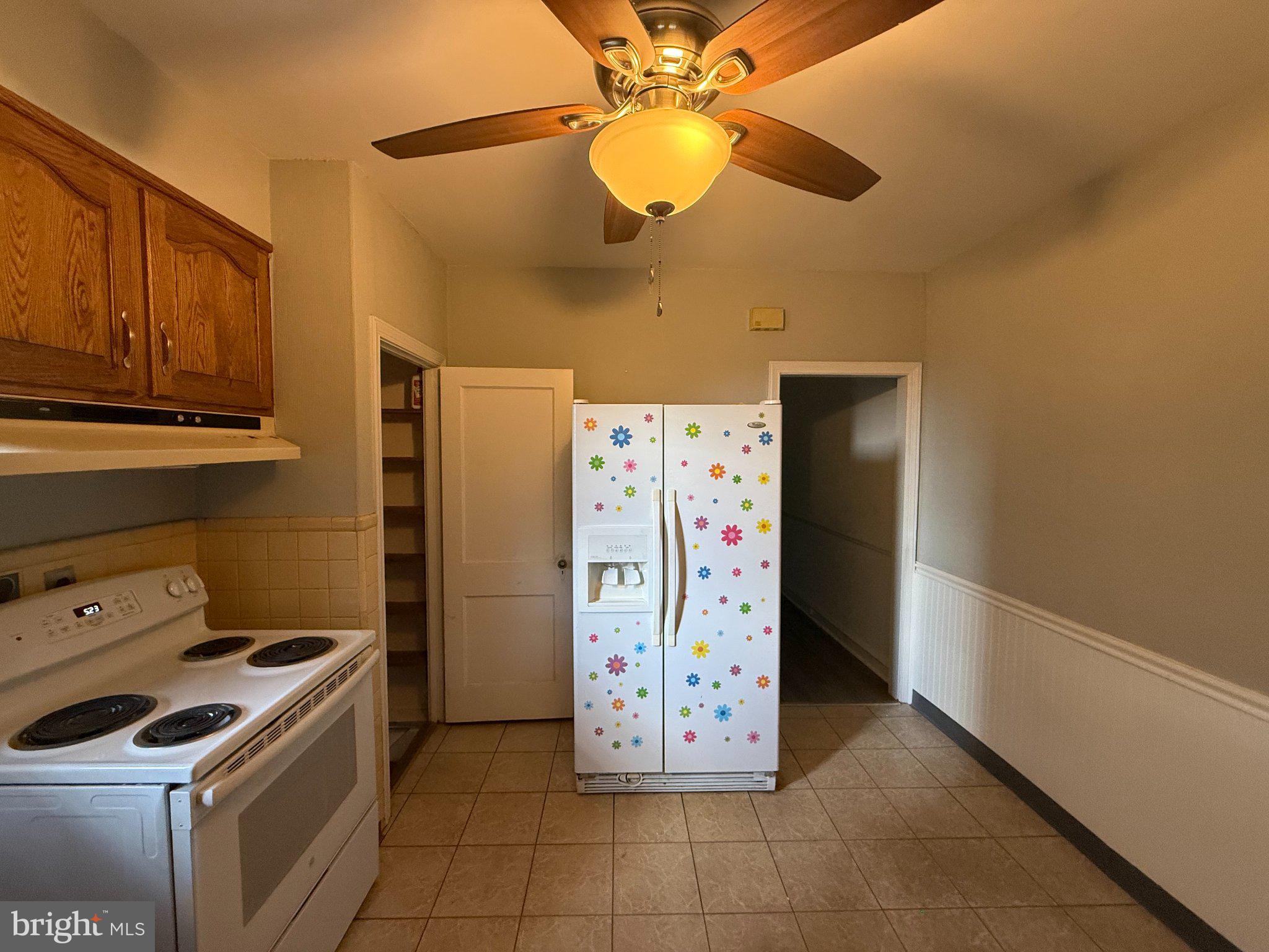 3148 Rawle Street Philadelphia, PA 19149 - Photo 10 of 33 Bright kitchen with playful decor.