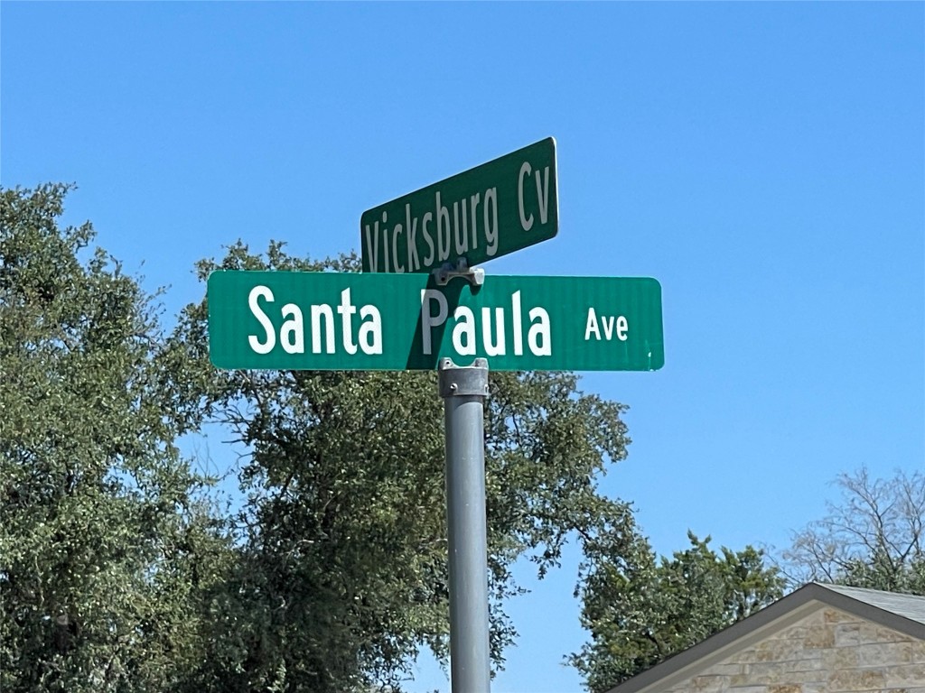 a street sign on a pole on a street