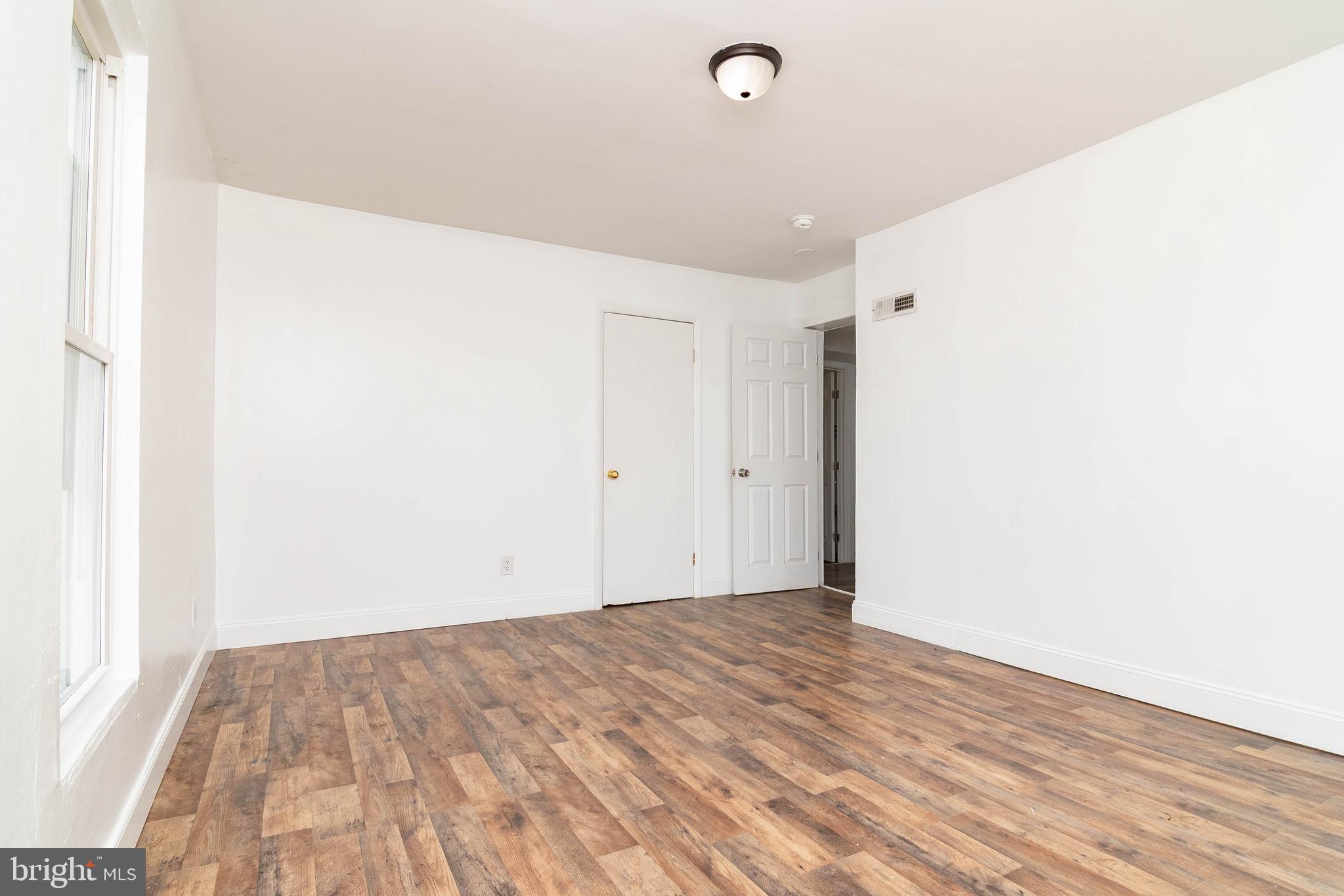 235 West 10th Street Laurel, DE 19956 - Photo 16 of 44 a view of a room with wooden floor