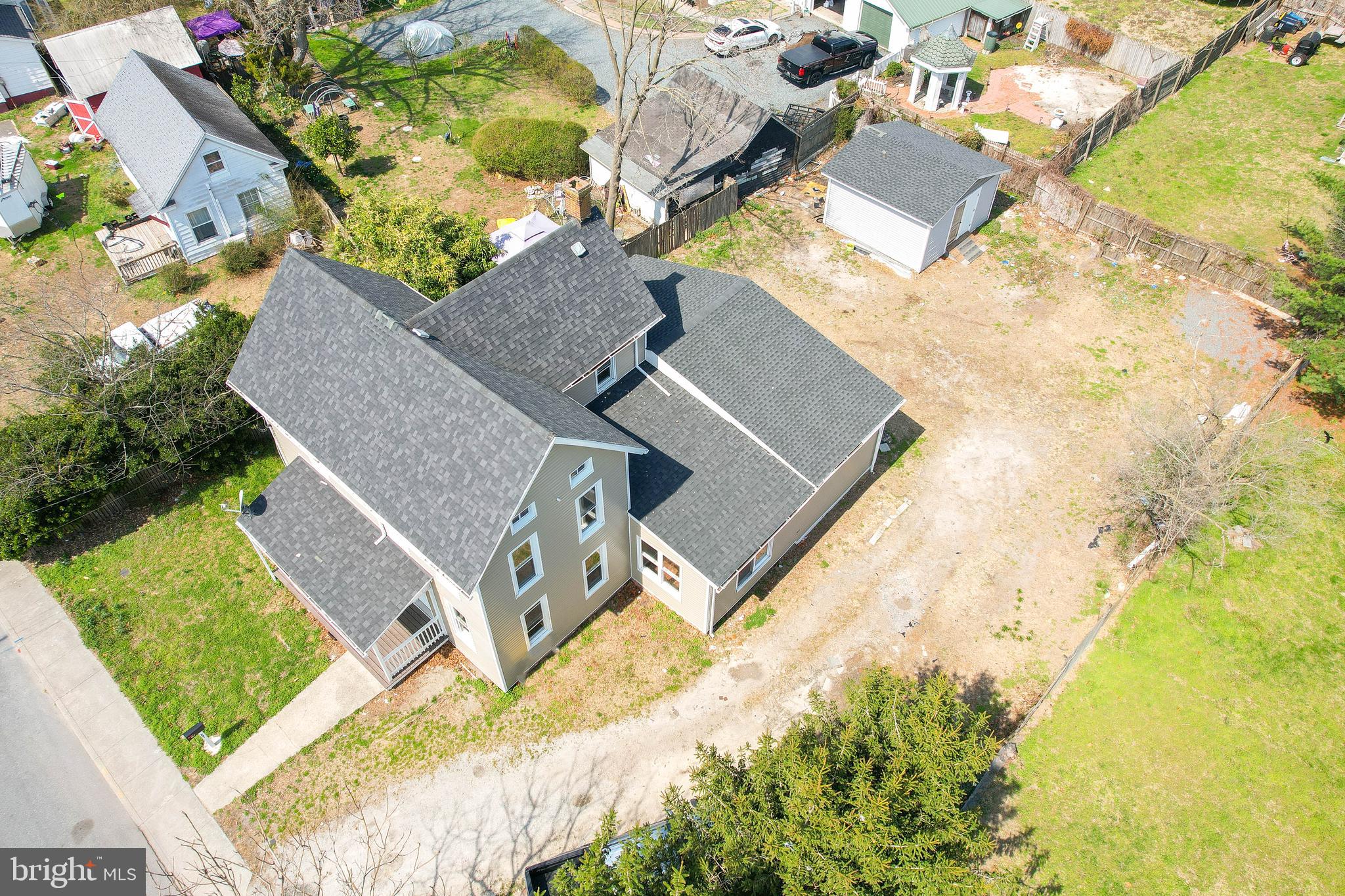 235 West 10th Street Laurel, DE 19956 - Photo 40 of 44 an aerial view of a house with a yard and trees