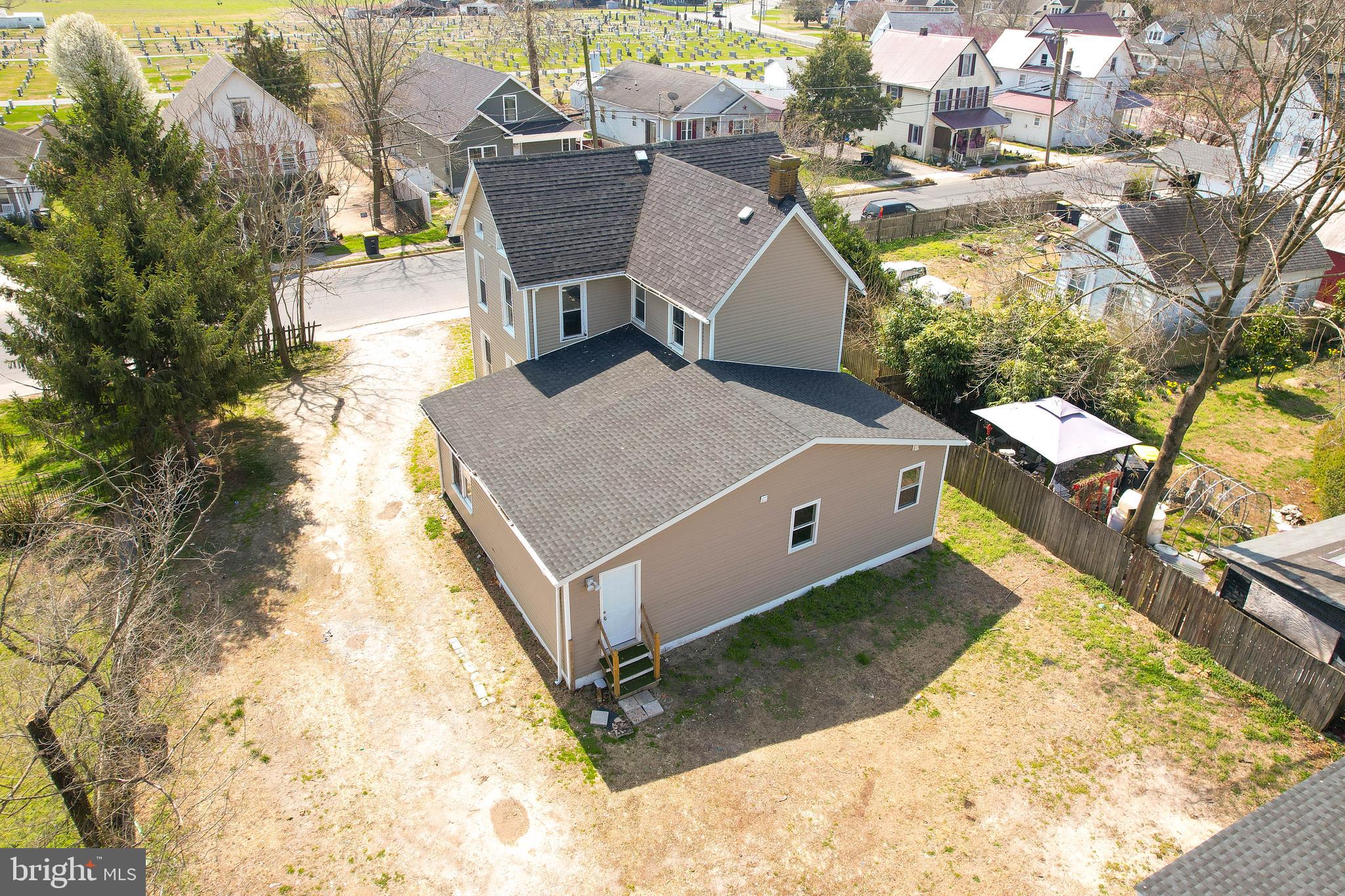 235 West 10th Street Laurel, DE 19956 - Photo 41 of 44 a aerial view of a house with large trees