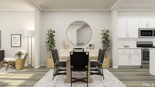 a view of kitchen with stainless steel appliances cabinets
