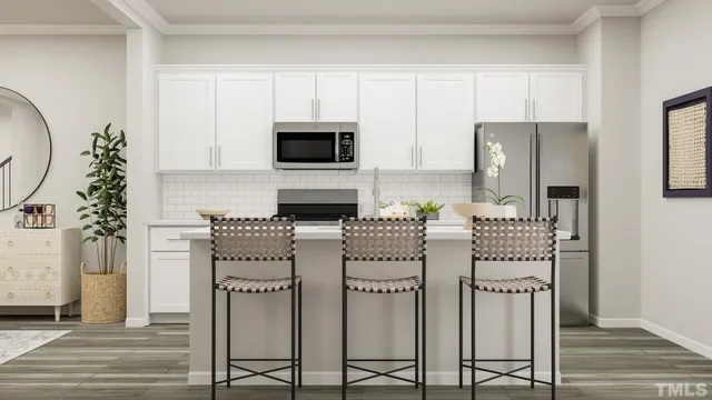 a living room with furniture and a painting on the wall