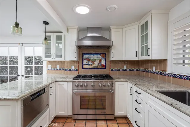 a view of a big room with wooden floor and windows