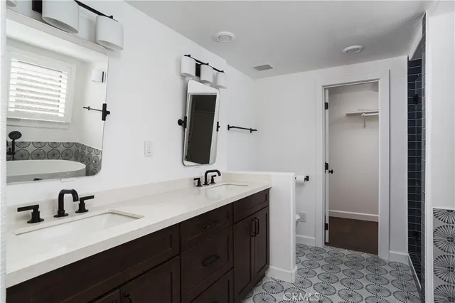 a bathroom with a bathtub and a window