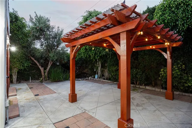 an aerial view of residential houses with outdoor space and swimming pool