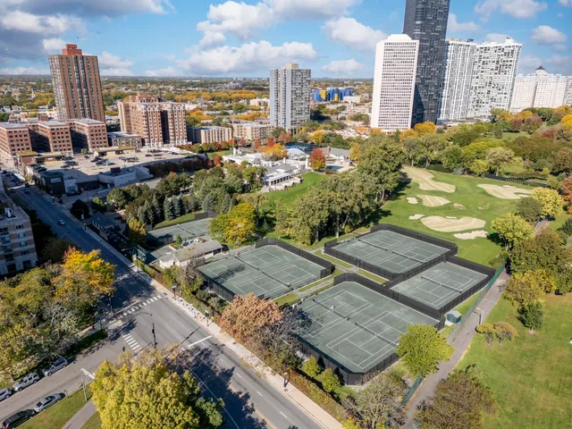 a view of a patio with a table and chairs
