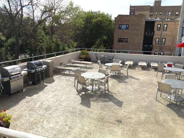a utility room with dryer and flowers