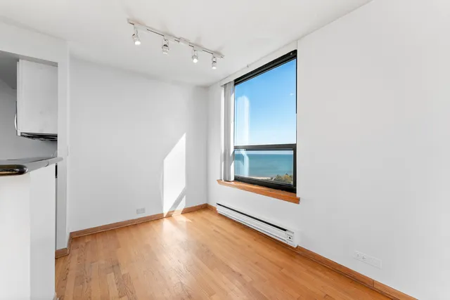 a kitchen with a refrigerator and a sink