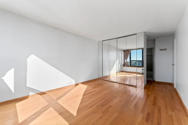 a bathroom with a sink mirror vanity and toilet