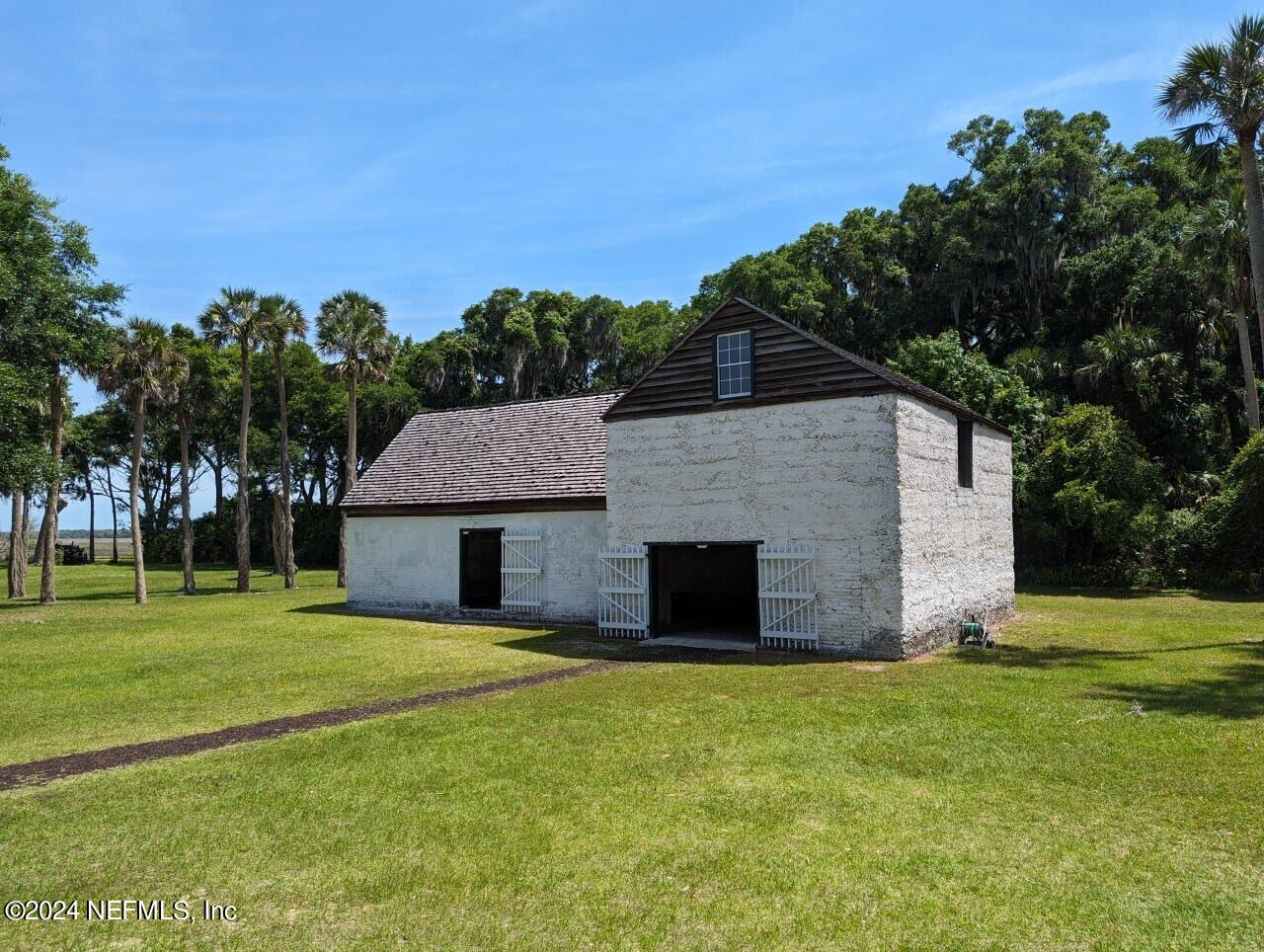 0 Salt Marsh Trail Jacksonville, FL 32226 - Photo 37 of 37 a backyard of a house with lots of green space and outdoor seating