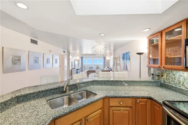 a kitchen with sink and cabinets