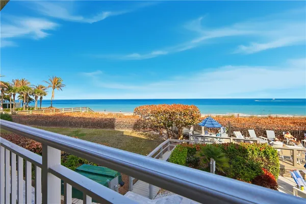 a large bedroom with bed and a fireplace