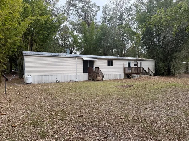 a backyard of a house with lots of green space