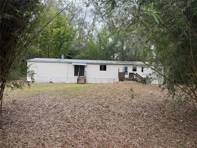 a house with trees in front of it