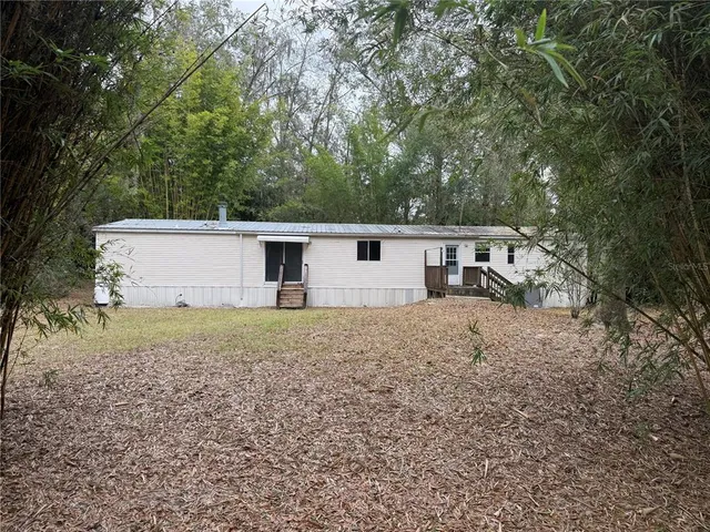 front view of a house with a trees