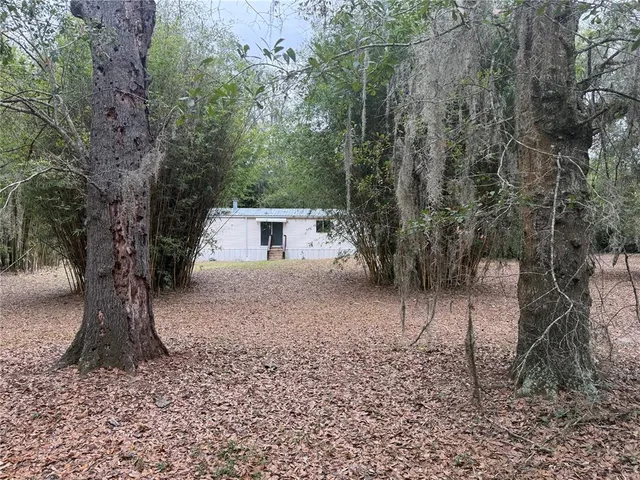 a view of room with window and wooden floor