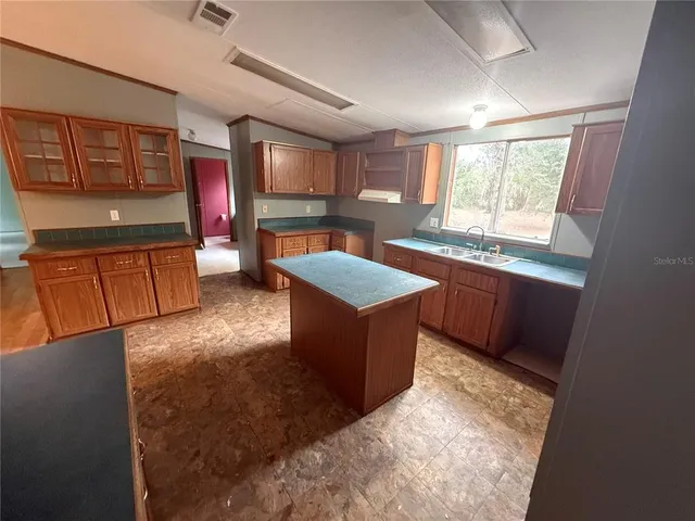 a bedroom with a bed and a mirror