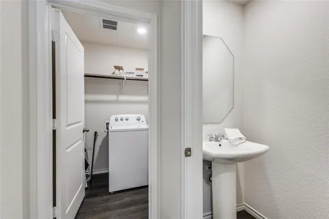 a bathroom with a sink and mirror