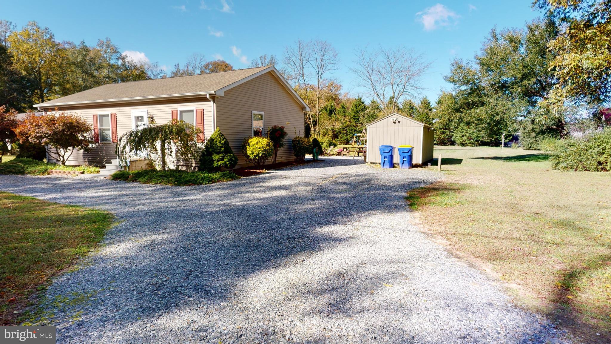 20865 Hummingbird Road Ellendale, DE 19941 - Photo 2 of 17 View from the street with 1st out building