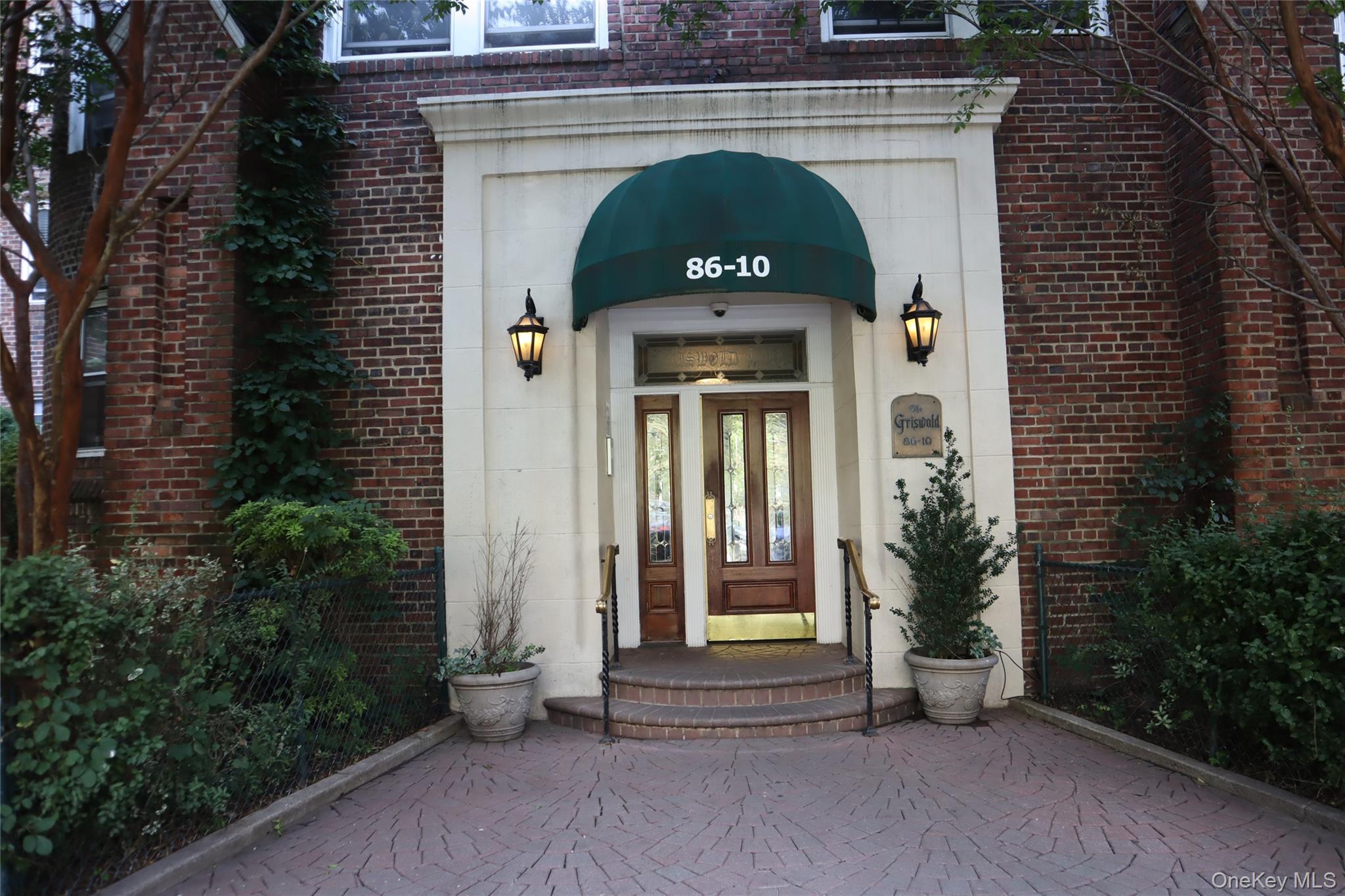 86-10 34th Avenue, Unit 624 Queens, NY 11372 - Photo 1 of 20 Property entrance with brick siding and french doors