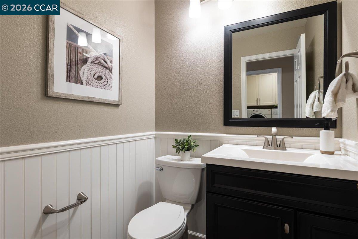 57 Karkin Place Clayton, CA 94517 - Photo 13 of 36 a bathroom with a sink and a mirror with toilet