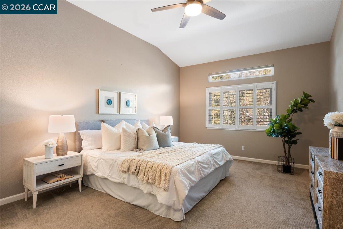 57 Karkin Place Clayton, CA 94517 - Photo 14 of 36 a bedroom with a bed and a potted plant