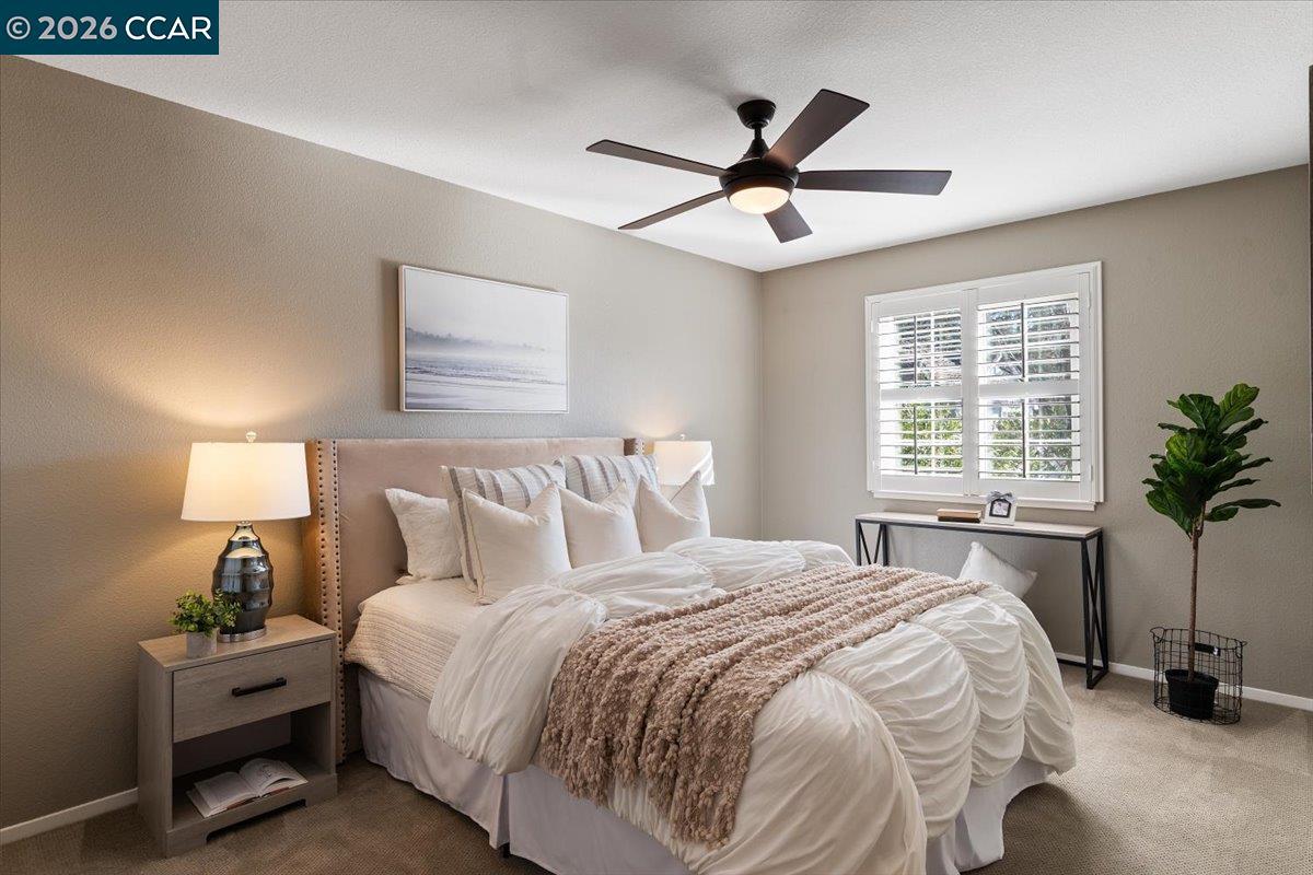 57 Karkin Place Clayton, CA 94517 - Photo 18 of 36 a bedroom with a bed and window