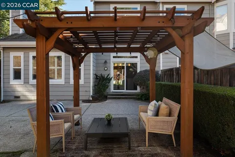 a patio with table and chairs