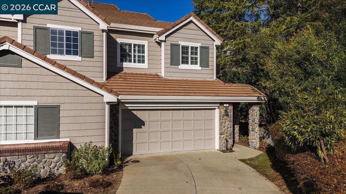 57 Karkin Place Clayton, CA 94517 - Photo 3 of 36 a front view of a house with a garage